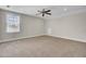 Large bedroom featuring plush carpeting, a ceiling fan, and a bright window at 112 Tin Can Aly, Summerville, SC 29483