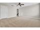 Spacious bonus room with neutral carpeting, ceiling fan, and walk in closet at 112 Tin Can Aly, Summerville, SC 29483