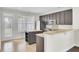 Modern kitchen with dark cabinets, stainless steel appliances, and an island at 112 Tin Can Aly, Summerville, SC 29483