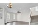 Open-concept living room with wood floors, staircase, and recessed lighting at 112 Tin Can Aly, Summerville, SC 29483