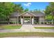 Community pool house with wooden structure and black metal fence near lush landscaping at 112 Tin Can Aly, Summerville, SC 29483