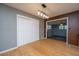 Open dining room with wood floors, modern light fixture, and access to a living space at 1121 Inverness Ln, Hanahan, SC 29410