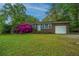 Charming single story brick home with an attached garage and a well manicured front lawn at 1121 Inverness Ln, Hanahan, SC 29410