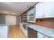 Updated kitchen featuring granite countertops, a stainless sink, and modern appliances at 1121 Inverness Ln, Hanahan, SC 29410