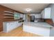 Updated kitchen featuring white cabinets, granite countertops, and modern appliances at 1121 Inverness Ln, Hanahan, SC 29410