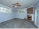 Comfortable living room featuring a fireplace, carpet floors, and bright light at 1121 Inverness Ln, Hanahan, SC 29410