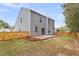 Backyard featuring a wooden fence and brick patio at 1158 Peninsula Cove Dr, Charleston, SC 29492