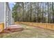 Backyard featuring a wooden fence and brick patio at 1158 Peninsula Cove Dr, Charleston, SC 29492