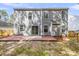 Backyard featuring a wooden fence and brick patio at 1158 Peninsula Cove Dr, Charleston, SC 29492