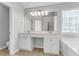 Bathroom with a double vanity, large mirror, and soaking tub at 1158 Peninsula Cove Dr, Charleston, SC 29492