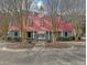 Charming community clubhouse with red roof, tower, and inviting entrance perfect for gatherings at 1158 Peninsula Cove Dr, Charleston, SC 29492