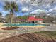 A large community pool with a red roofed pavilion at 1158 Peninsula Cove Dr, Charleston, SC 29492