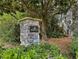 The black stone and gray brick sign reading 