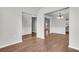 Open-concept dining room flows into the kitchen, showcasing fresh paint, and wood-look floors at 1158 Peninsula Cove Dr, Charleston, SC 29492