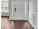 Inviting foyer features modern door with sidelights, fresh paint, and decorative trim at 1158 Peninsula Cove Dr, Charleston, SC 29492