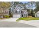 Well-maintained home with two-car garage, manicured lawn, and inviting curb appeal at 1158 Peninsula Cove Dr, Charleston, SC 29492