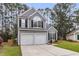 Charming home featuring a two-car garage, manicured landscaping, and a traditional design at 1158 Peninsula Cove Dr, Charleston, SC 29492
