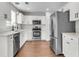 Beautiful kitchen boasts stainless steel appliances, quartz counters, and updated fixtures at 1158 Peninsula Cove Dr, Charleston, SC 29492