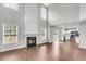 Spacious living room boasts high ceilings, fireplace and flows into kitchen at 1158 Peninsula Cove Dr, Charleston, SC 29492