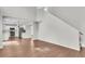 Living room view with staircase and view into the kitchen area at 1158 Peninsula Cove Dr, Charleston, SC 29492