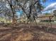 Community playground featuring a swing set, lending library, bench, and shade trees at 1158 Peninsula Cove Dr, Charleston, SC 29492
