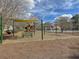A playground with a slide and swings and a picnic table on pine straw at 1158 Peninsula Cove Dr, Charleston, SC 29492