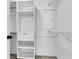 Walk-in closet featuring built-in shelves and hanging racks at 1158 Peninsula Cove Dr, Charleston, SC 29492