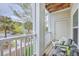Balcony with seating overlooks a view of trees at 1300 Park West Blvd # 517, Mount Pleasant, SC 29466