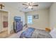 Relaxing bedroom with a ceiling fan, natural light, closet and TV on the dresser at 1300 Park West Blvd # 517, Mount Pleasant, SC 29466
