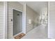 Apartment hallway features neutral tones, multiple doors, and staircase access at 1300 Park West Blvd # 517, Mount Pleasant, SC 29466