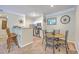 Open-concept kitchen with a breakfast bar and views of the dining area at 1300 Park West Blvd # 517, Mount Pleasant, SC 29466