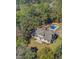 Picturesque aerial view of a charming home with a pool and a delightful black and white tiled patio at 1300 S Main St, Summerville, SC 29483