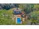 Aerial view showcasing the home with a pool, patio, and lush green landscape at 1300 S Main St, Summerville, SC 29483