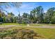 Aerial view of a beautiful home and sprawling green lawn at 1300 S Main St, Summerville, SC 29483