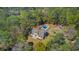 Aerial view featuring lush trees, pool, long driveway, and manicured lawn at 1300 S Main St, Summerville, SC 29483