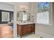 Bathroom with a double vanity, hardwood floors, and ample natural light at 1300 S Main St, Summerville, SC 29483