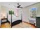 Bedroom featuring a bed, side table, and windows offering plenty of natural light at 1300 S Main St, Summerville, SC 29483