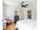 Cozy bedroom features a bed, ceiling fan, chair, and a radiator for heating at 1300 S Main St, Summerville, SC 29483