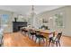 Spacious dining room with fireplace, chandelier, wood floors, and natural light at 1300 S Main St, Summerville, SC 29483