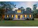Charming two-story home featuring a checkerboard porch and symmetrical facade at 1300 S Main St, Summerville, SC 29483