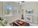 Bright living room with large windows, a decorative cabinet, and a comfortable seating area at 1300 S Main St, Summerville, SC 29483