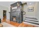 Cozy living room featuring a fireplace with dark wood trim and a staircase at 1300 S Main St, Summerville, SC 29483