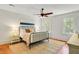 Comfortable bedroom with a ceiling fan, hardwood floors and two windows at 1300 S Main St, Summerville, SC 29483
