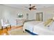 Comfortable bedroom with a ceiling fan, hardwood floors, television and windows at 1300 S Main St, Summerville, SC 29483