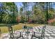 Inviting checkered tile patio with outdoor seating and lush garden views at 1300 S Main St, Summerville, SC 29483