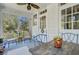 Bright and airy sunroom with comfortable seating, surrounded by windows offering views of the outdoors at 1300 S Main St, Summerville, SC 29483