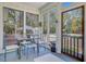 Sunroom featuring a dining table with a view of the backyard and pool at 1300 S Main St, Summerville, SC 29483