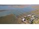 Stunning aerial view of waterfront properties with private docks offering an elevated perspective of coastal living at 1504 Forrest Ave, Folly Beach, SC 29439