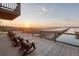 Relax and enjoy sunset views from this spacious deck with comfortable seating and tranquil marsh vistas at 1504 Forrest Ave, Folly Beach, SC 29439