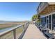 Expansive back deck with seating provides serene water views at 1504 Forrest Ave, Folly Beach, SC 29439